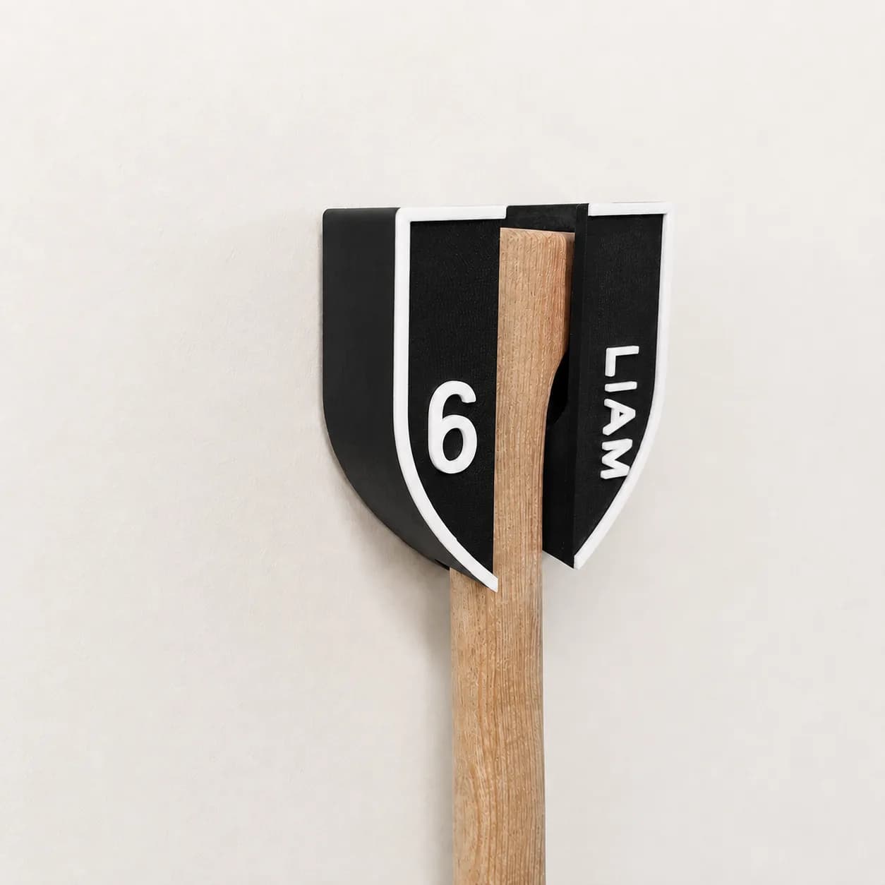 Black & white personalised hurley wall mount with LIAM · 6