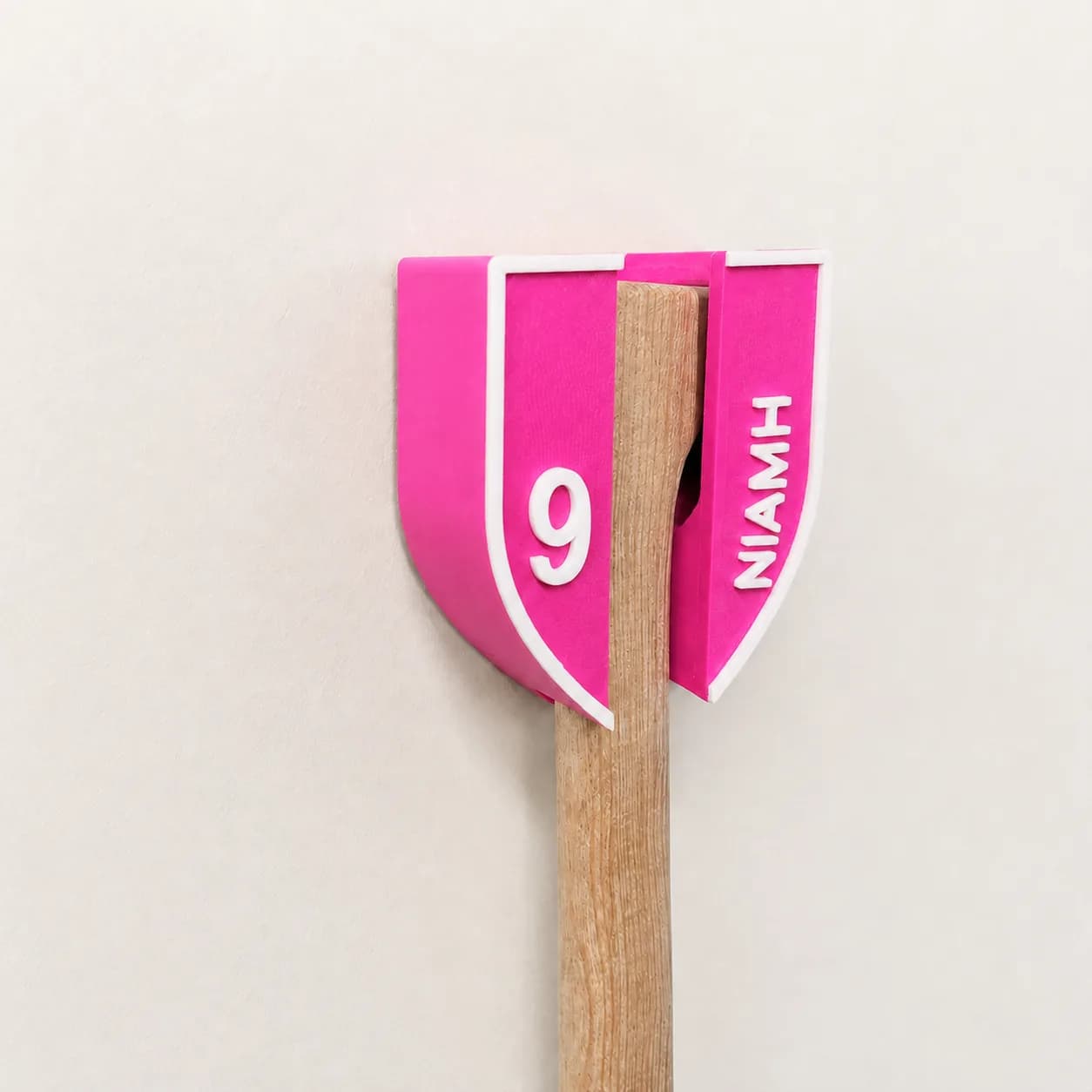 Pink & white personalised hurley wall mount with NIAMH · 9